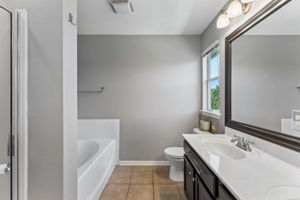 Primary Bathroom with Soaking Tub and Seperate Walk in Shower.