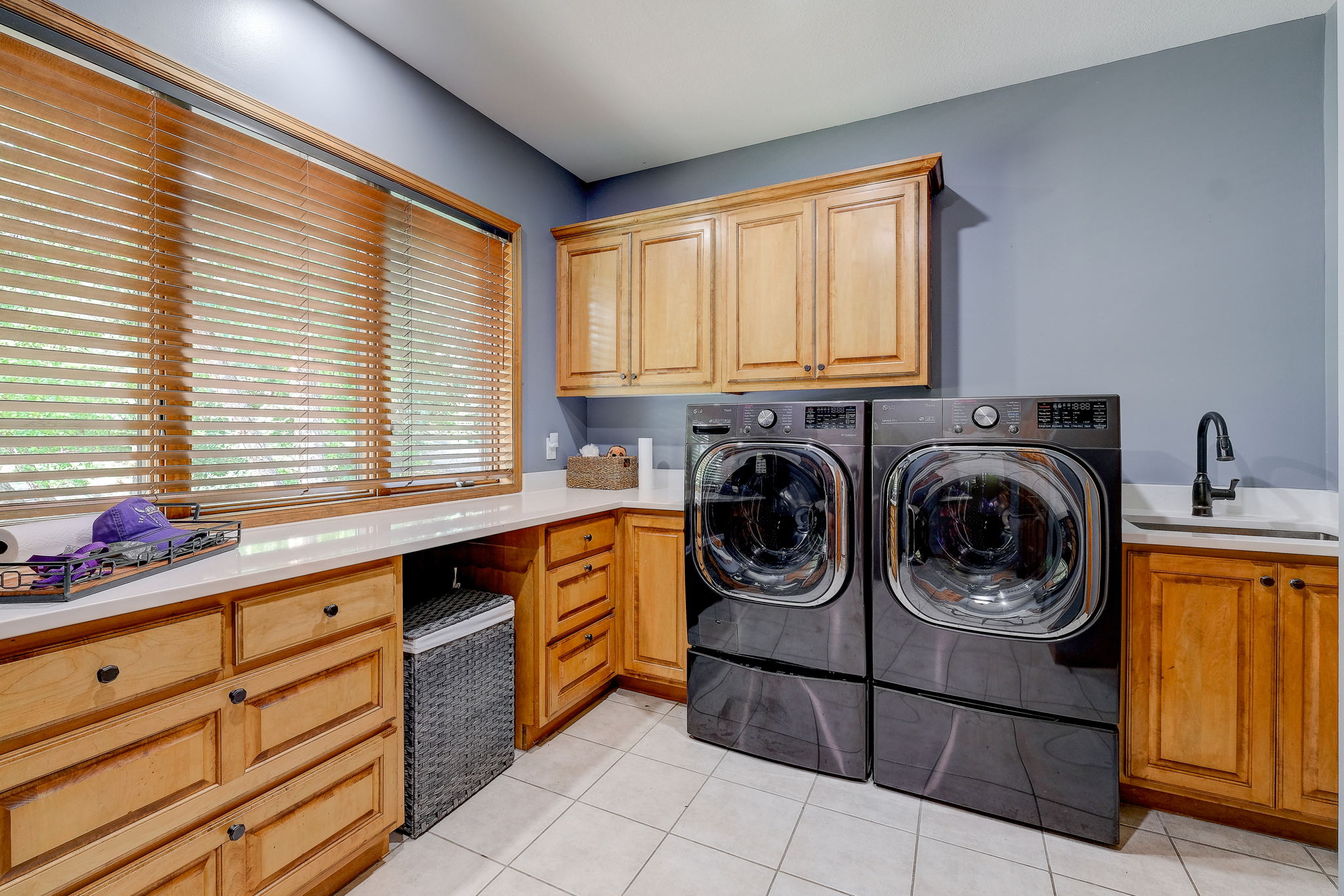 Main floor laundry with new washer/dryer.  Washer features mini wash load in bottom pedestal.