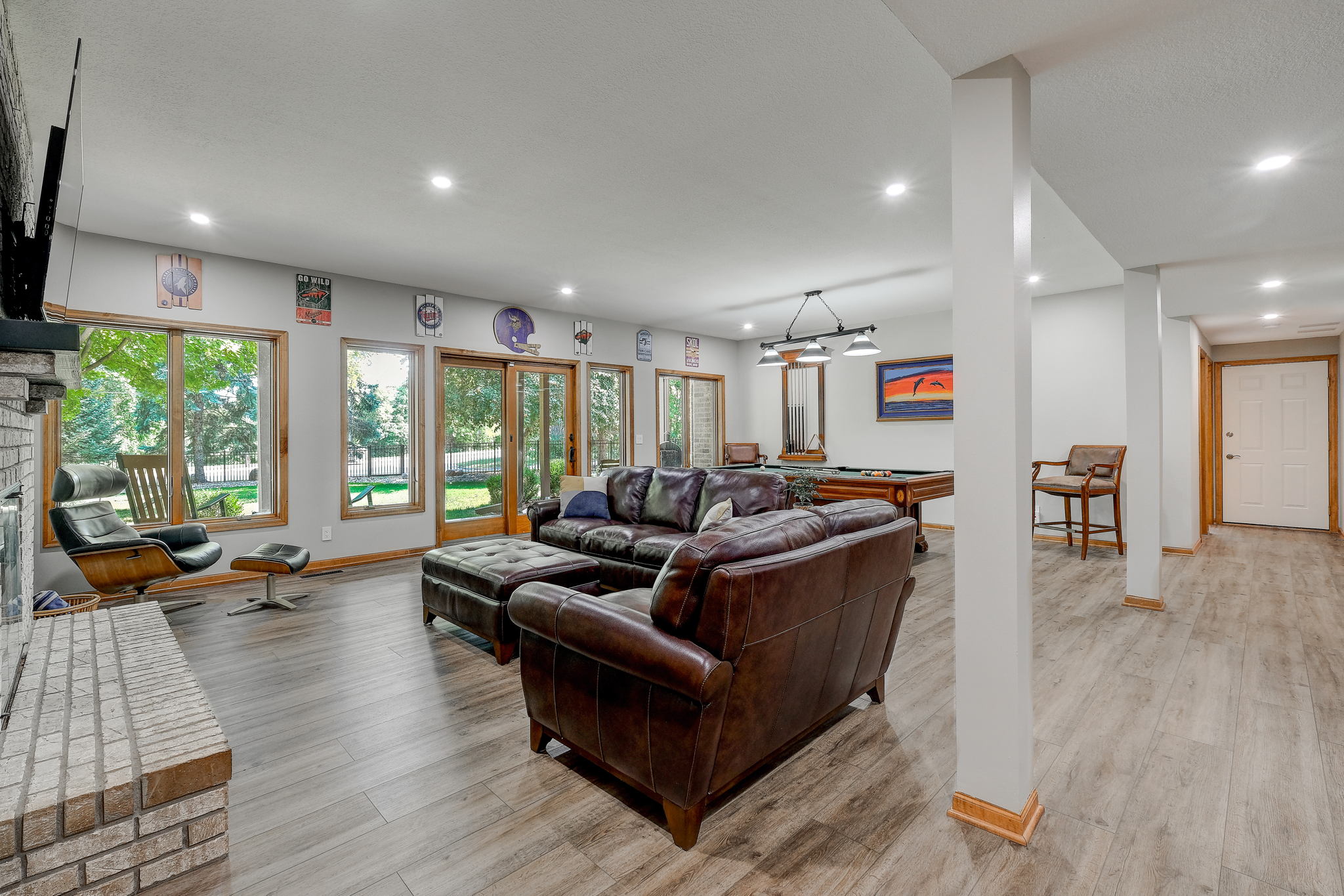 Spacious open LL Family room with fireplace and luxury vinyl throughout
