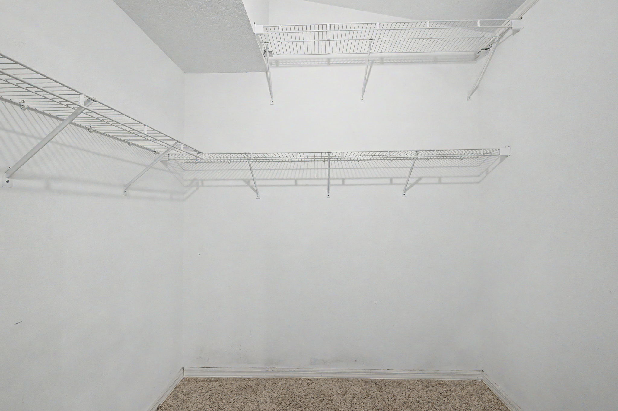 Primary Bedroom Walk-in Closet1b