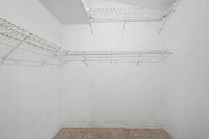 Primary Bedroom Walk-in Closet1b