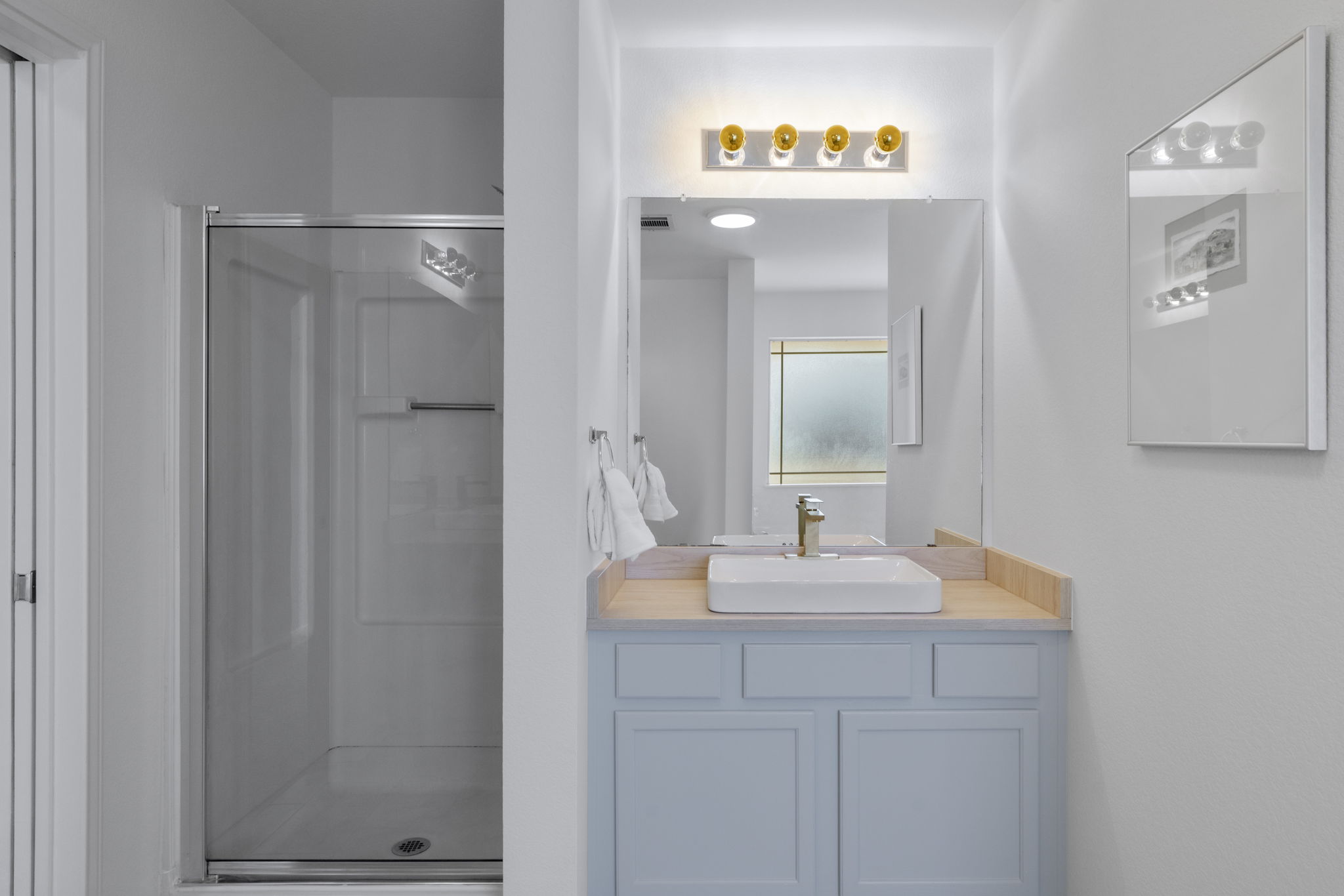 Primary bathroom Walk in Shower and two Vanities