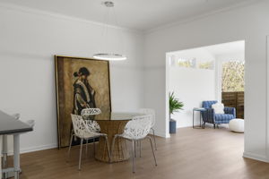 Spacious Dining Room with designer light fixtures
