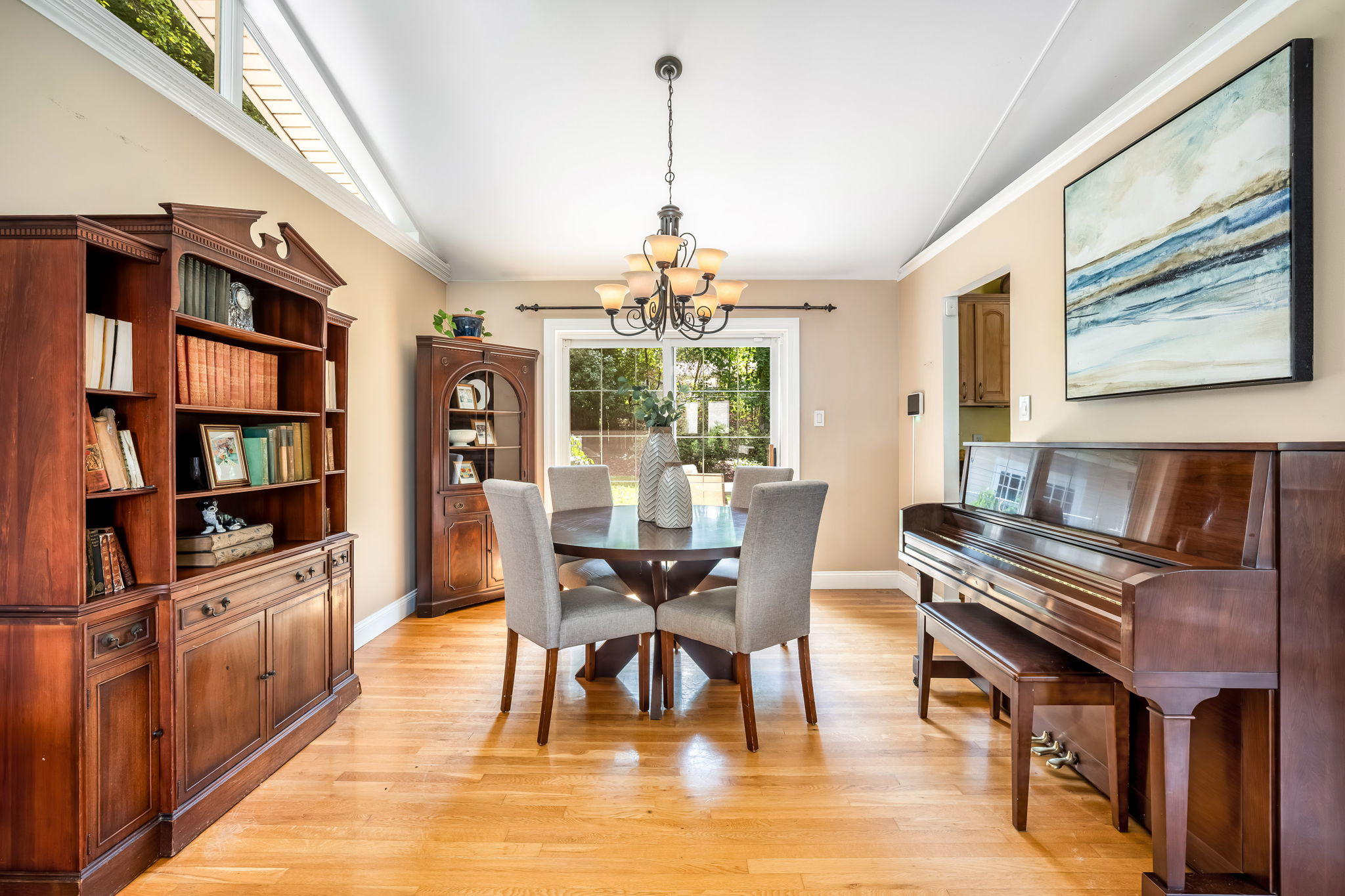 Open living/dining room with vaulted ceiling