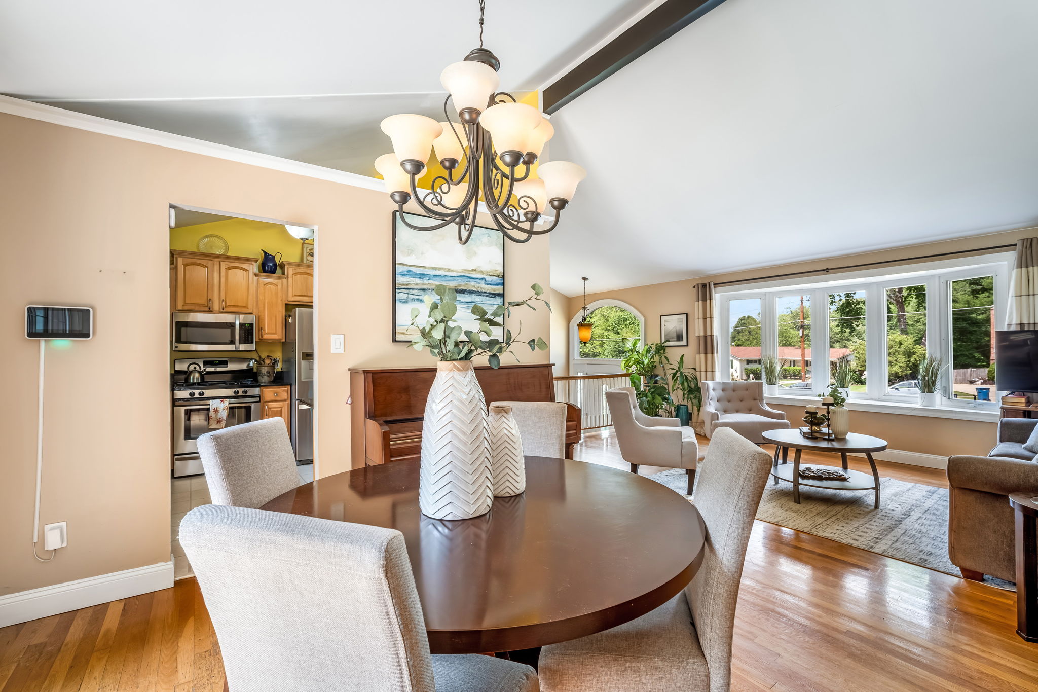 Open living/dining room with vaulted ceiling