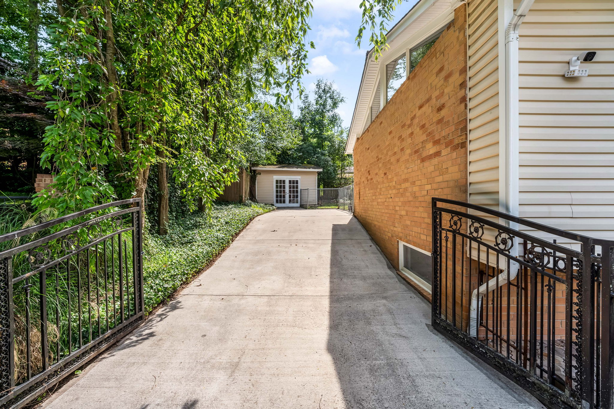 Expansive driveway and storage sheds
