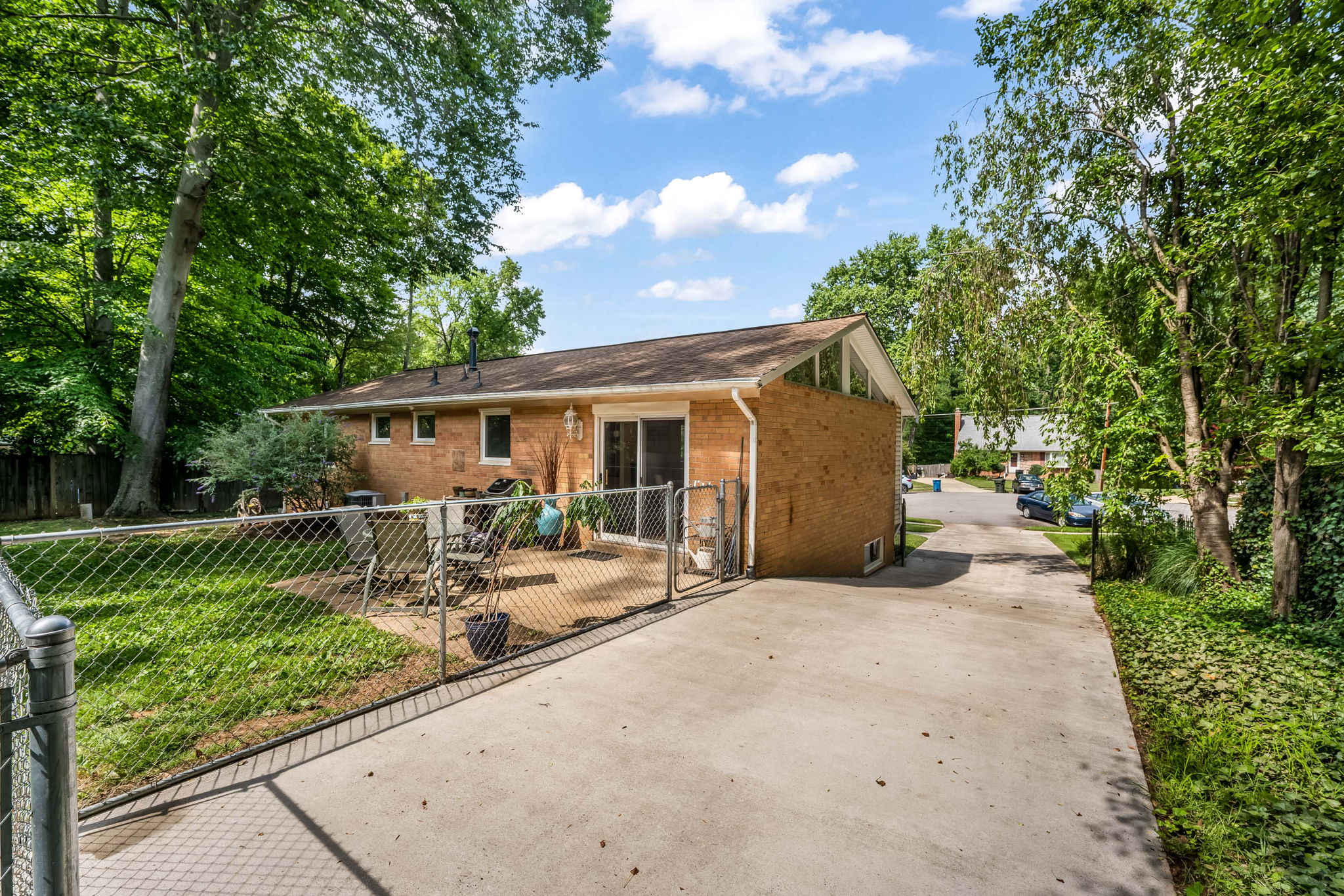 Expansive driveway and storage sheds