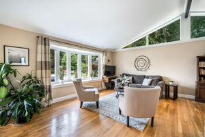 Open living/dining room with vaulted ceiling