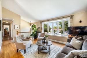Open living/dining room with vaulted ceiling