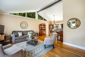 Open living/dining room with vaulted ceiling