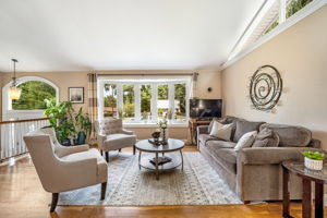 Open living/dining room with vaulted ceiling