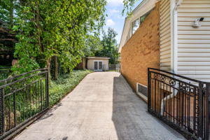 Expansive driveway and storage sheds