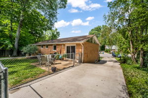 Expansive driveway and storage sheds