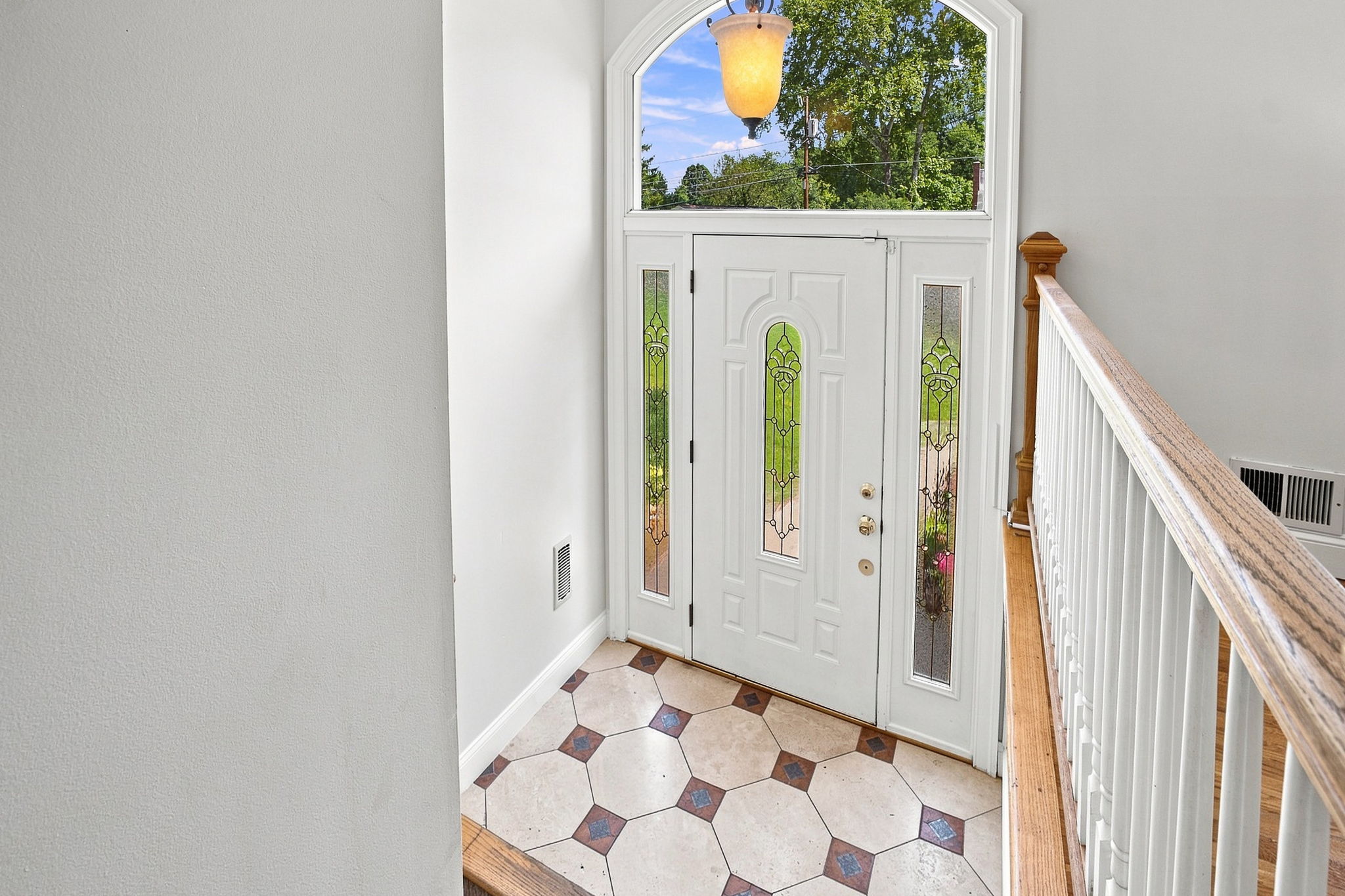 Sunny foyer with soaring ceiling