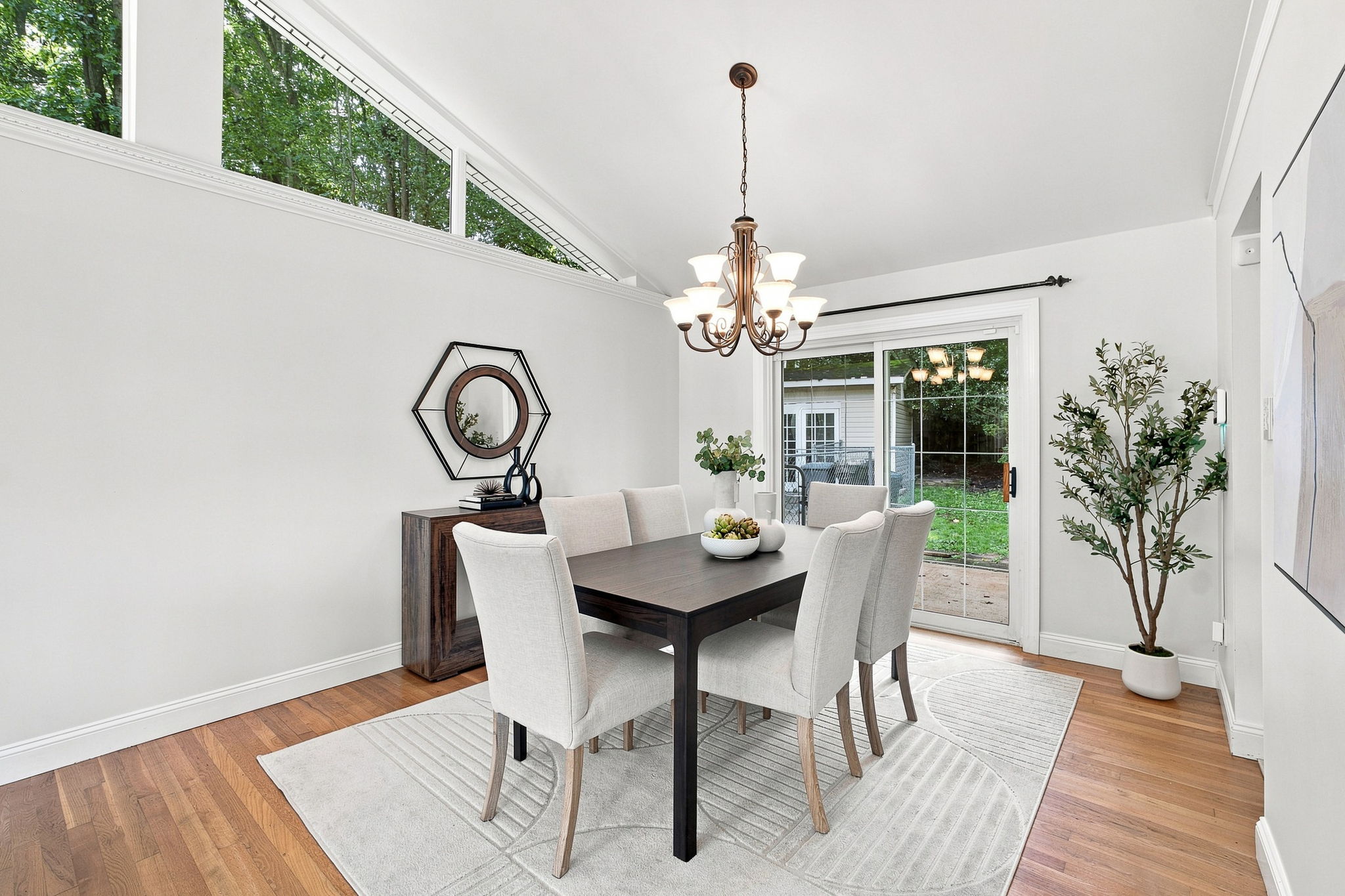 Dining room with vaulted ceiling opens to back patio
