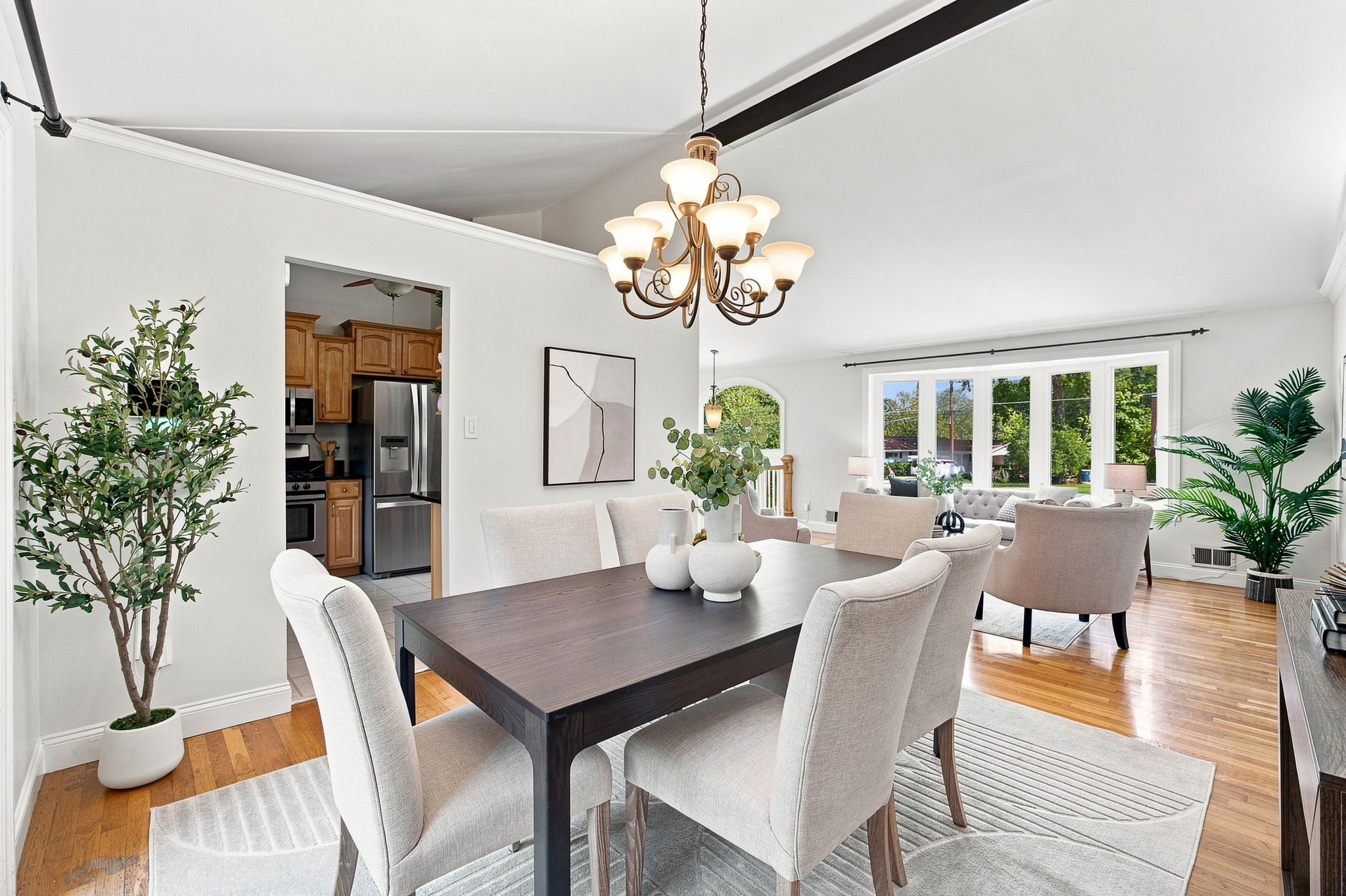 Dining room with vaulted ceiling opens to back patio
