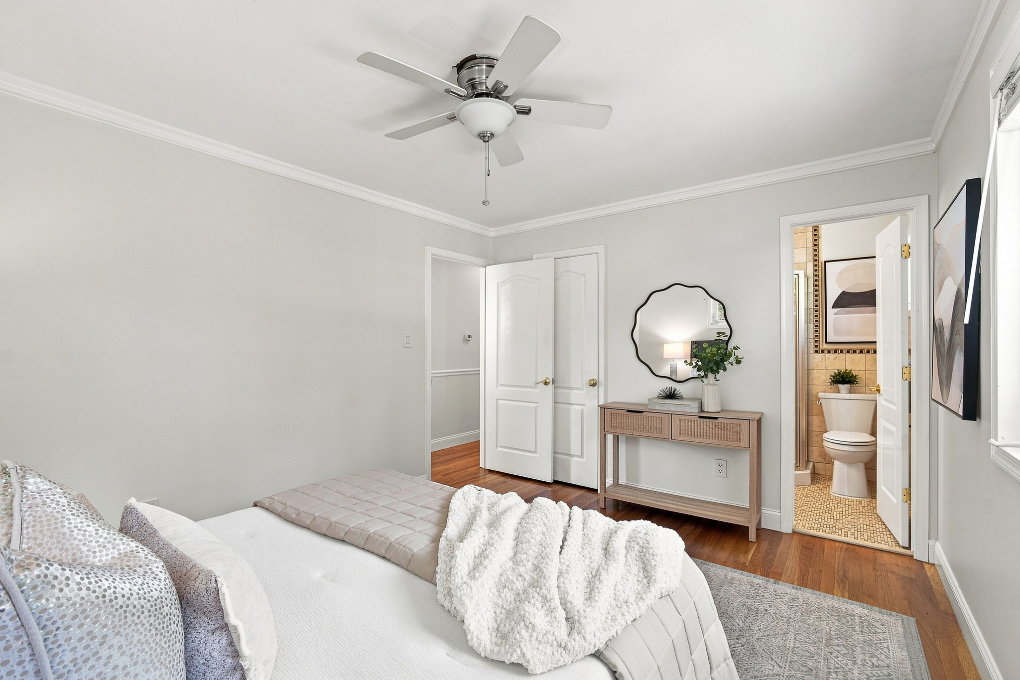 Ensuite primary bedroom with walk-in closet