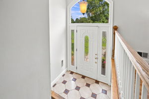 Sunny foyer with soaring ceiling