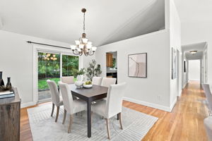 Dining room with vaulted ceiling opens to back patio