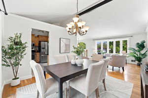 Dining room with vaulted ceiling opens to back patio