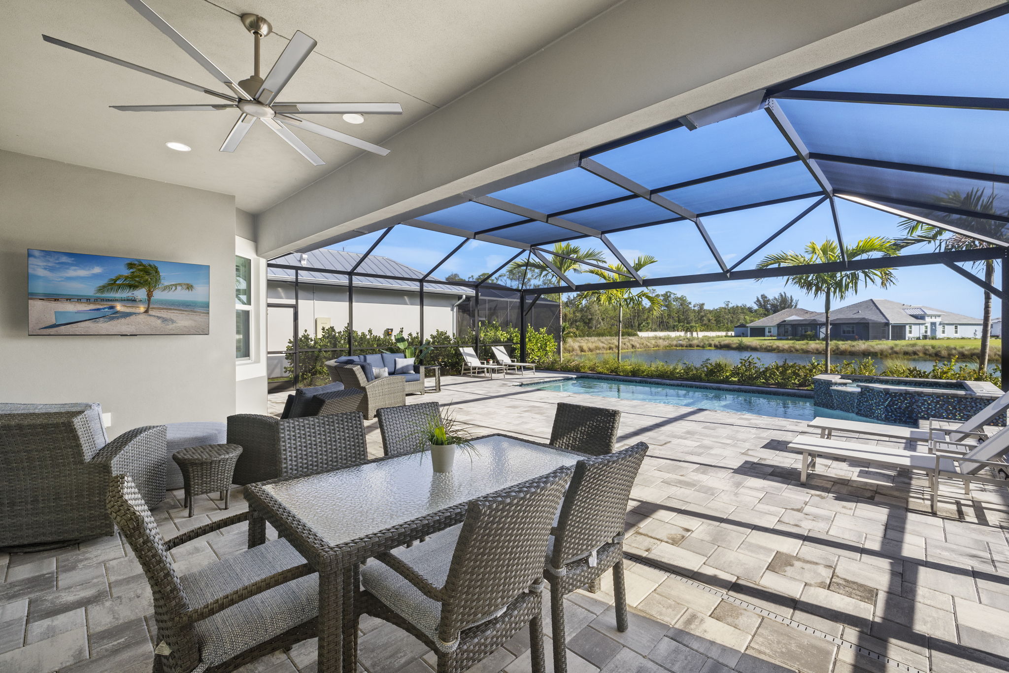 Expanded lanai featuring covered outdoor dining & living areas. Plenty of extra outdoor living space for lounging and relaxing.