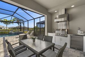 Covered, outdoor kitchen and eating area