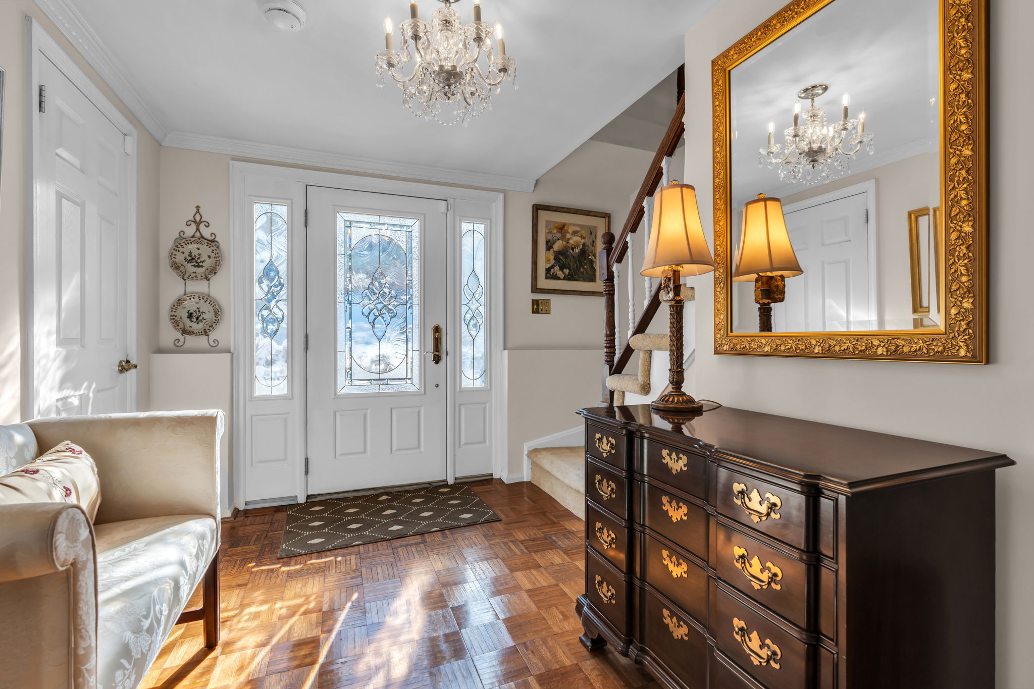 Formal foyer entry has access from  the front door and attached garage