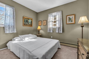 2nd bedroom, double closet, hardwood under carpet