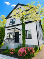 Front with azalea and tree in bloom