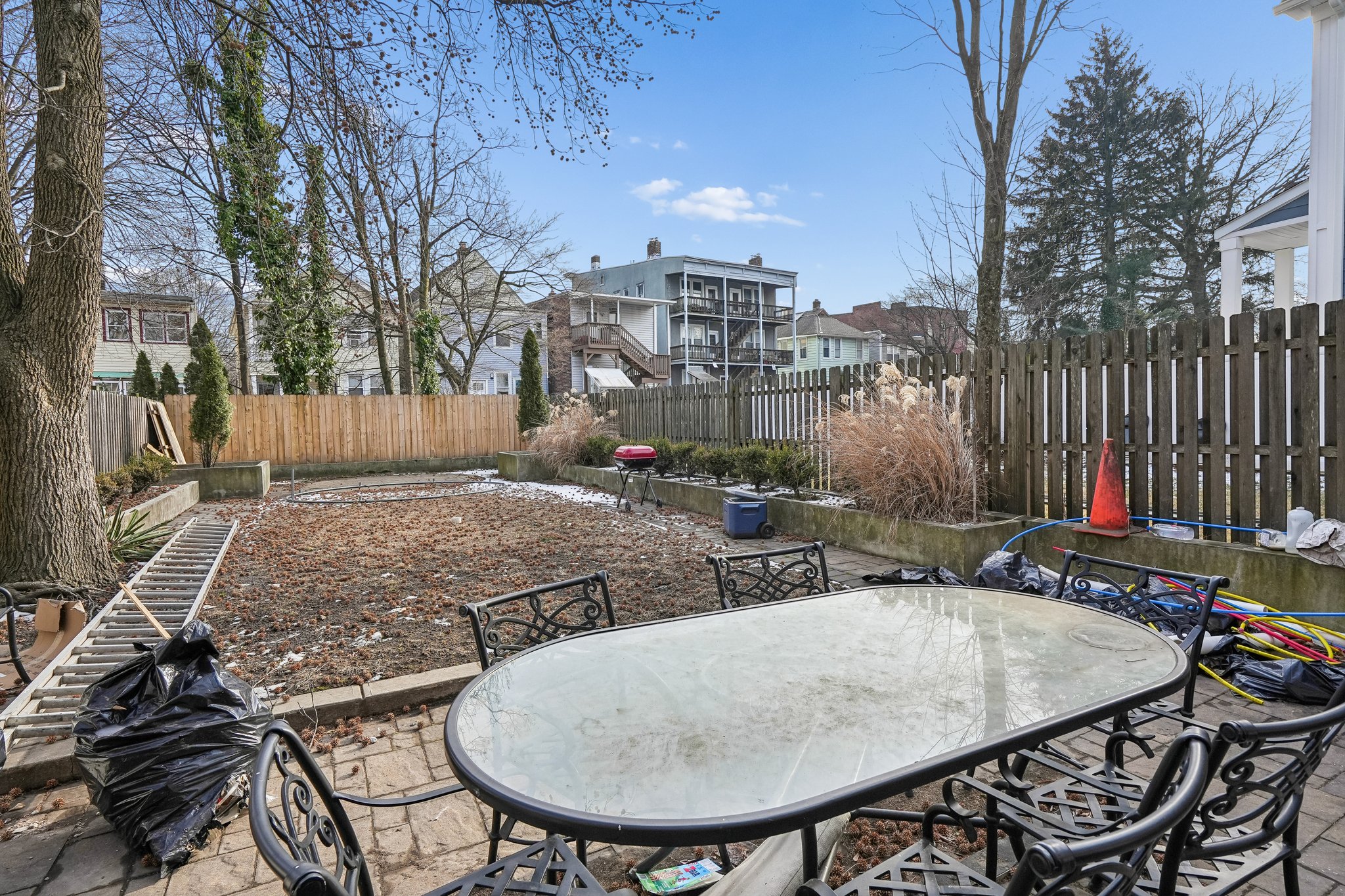 Patio and Yard; In season, the yard is a lovely green oasis with paver patio with use of outdoor furniture