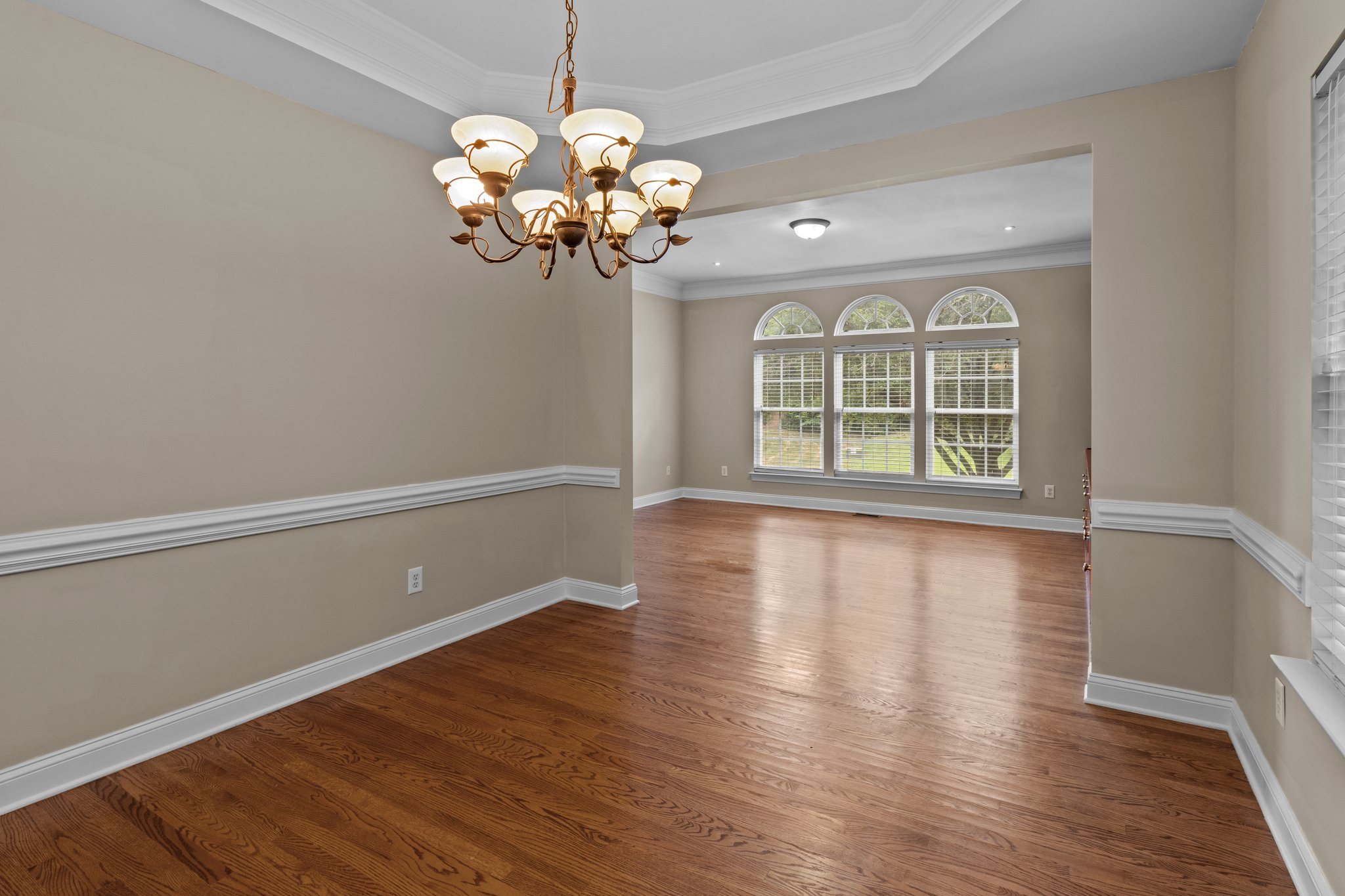 dining room with tray ceilings