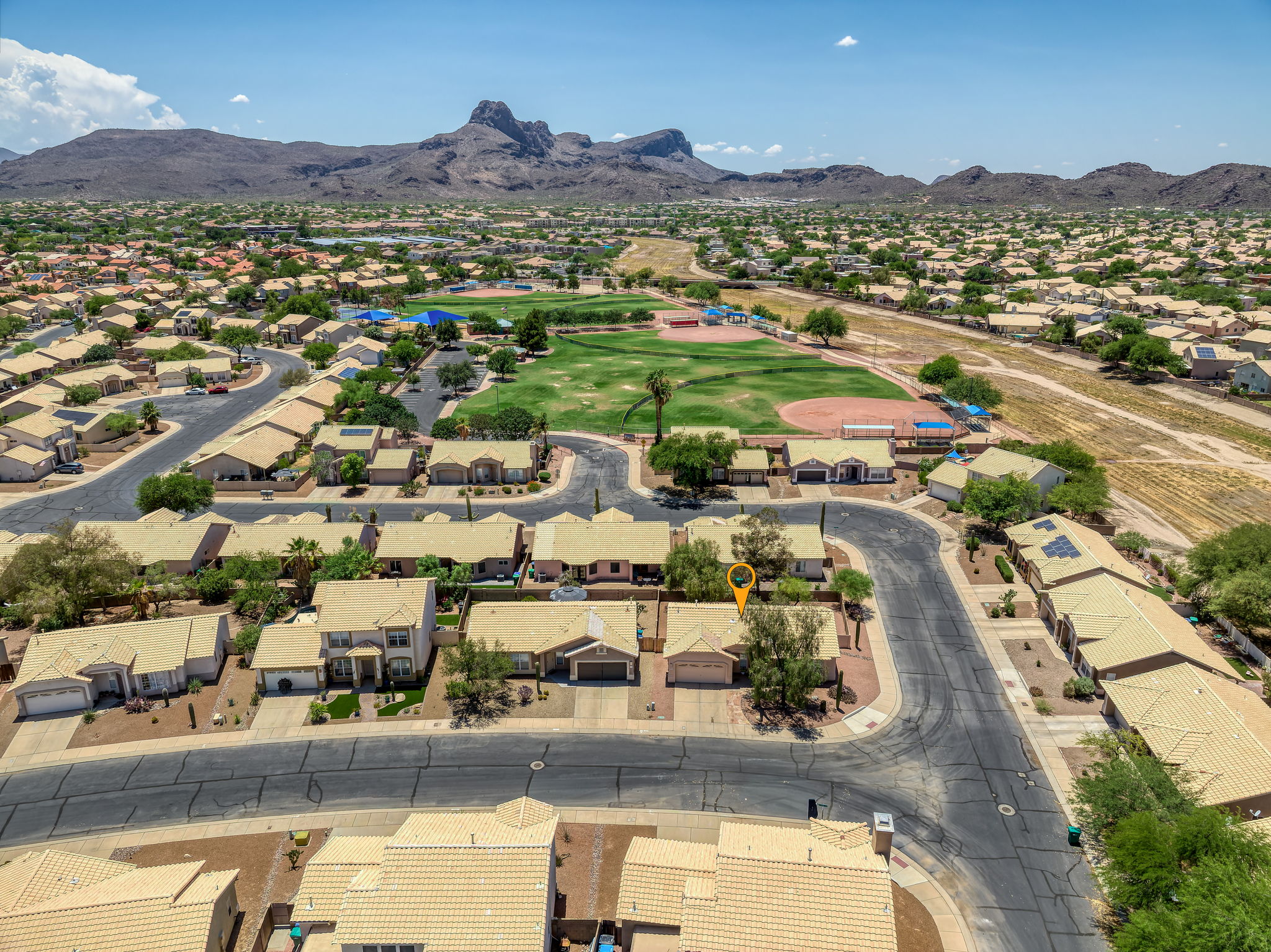 View of the house in proximity to the neighborhood park! Less than 2 minutes