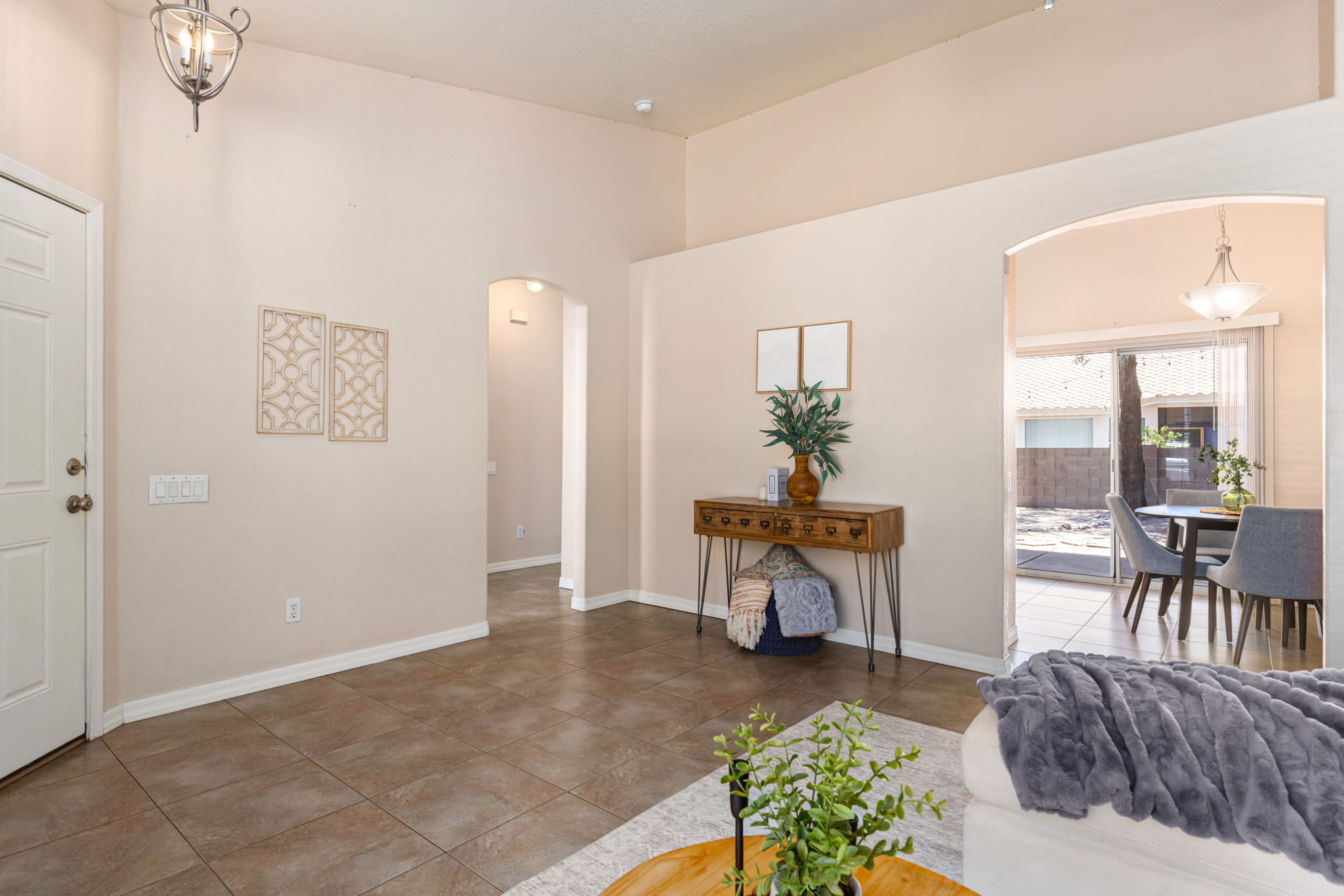 View into the kitchen, dining area and hallway.