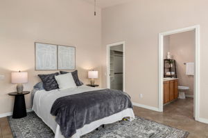 Spacious primary Bedroom with large walk in closet, vaulted ceilings and you're en-suite bathroom.