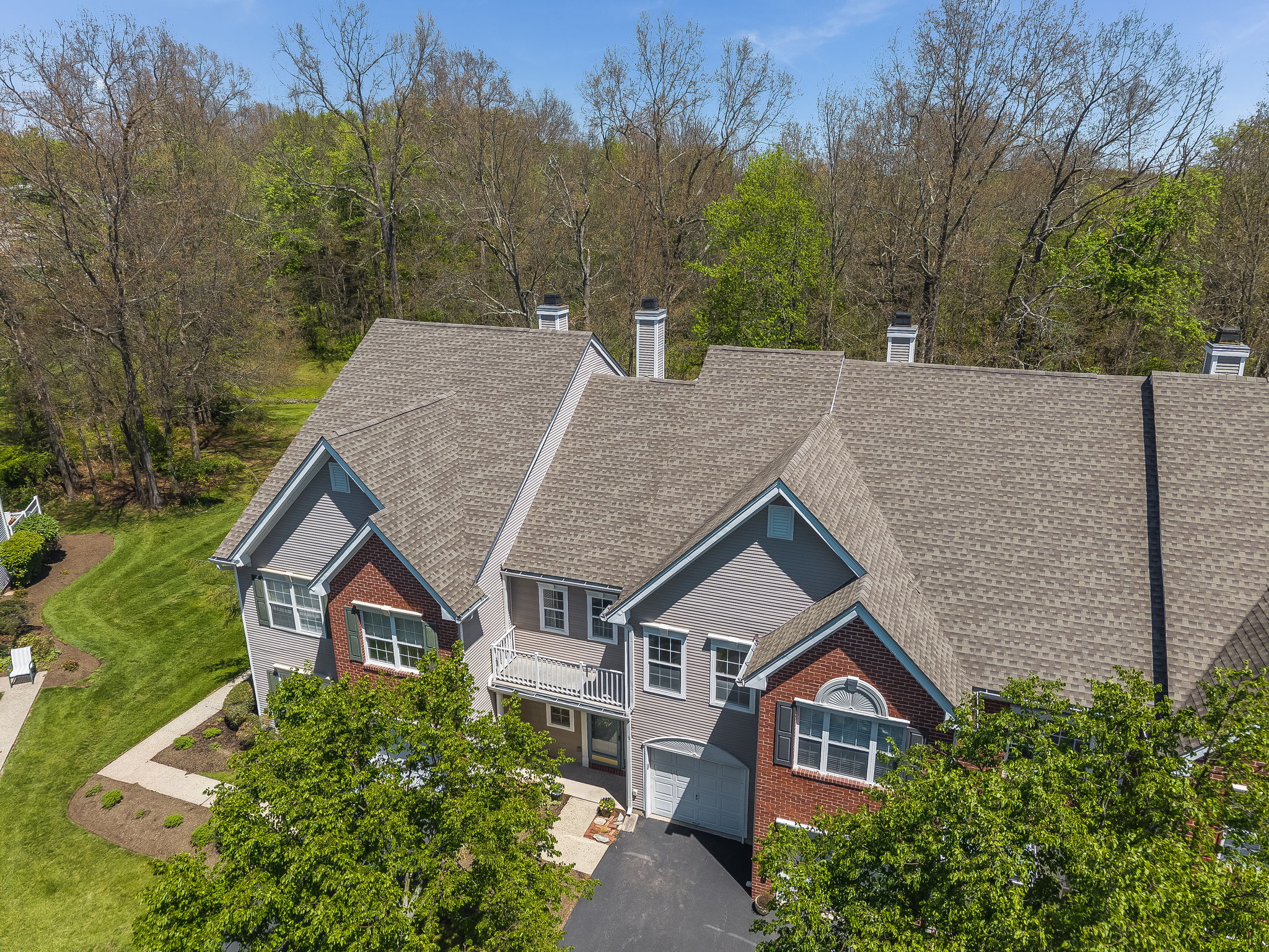 Interior townhouse in highly sought-after scenic Lake Cushetunk Woods. 1481 SF of thoughtfully designed living space, freshly painted in "Linen White creating a clean, versatile backdrop.
