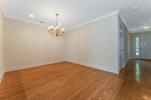 Hardwood flooring flows from the foyer into the dramatic two-story great room and formal dining room, highlighted by crown moulding.