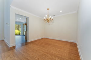Hardwood flooring flows from the foyer into the dramatic two-story great room and formal dining room, highlighted by crown moulding.