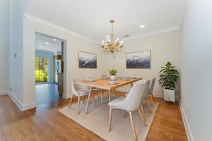 Virtually Staged. Hardwood flooring flows from the foyer into the dramatic two-story great room and formal dining room, highlighted by crown moulding.
