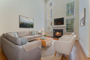 Virtually Staged-A gas fireplace with a classic mantel adds warmth and visual appeal to the great room. Oversized windows fill the open, airy floorplan with natural light.