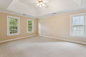 Primary bedroom with walk-in closet and en suite bath.