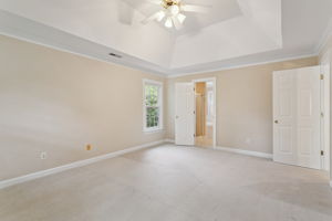 Tranquil primary bedroom perfect for rest and recharge.