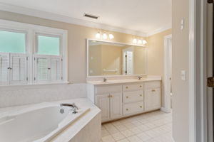 Functional and roomy primary bathroom.