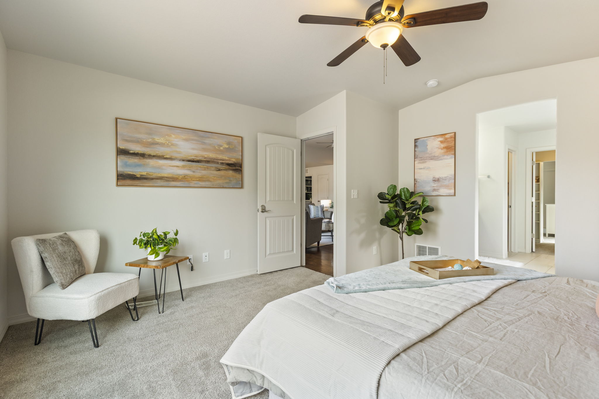 Spacious primary bedroom offering flexible furniture placement and natural light.