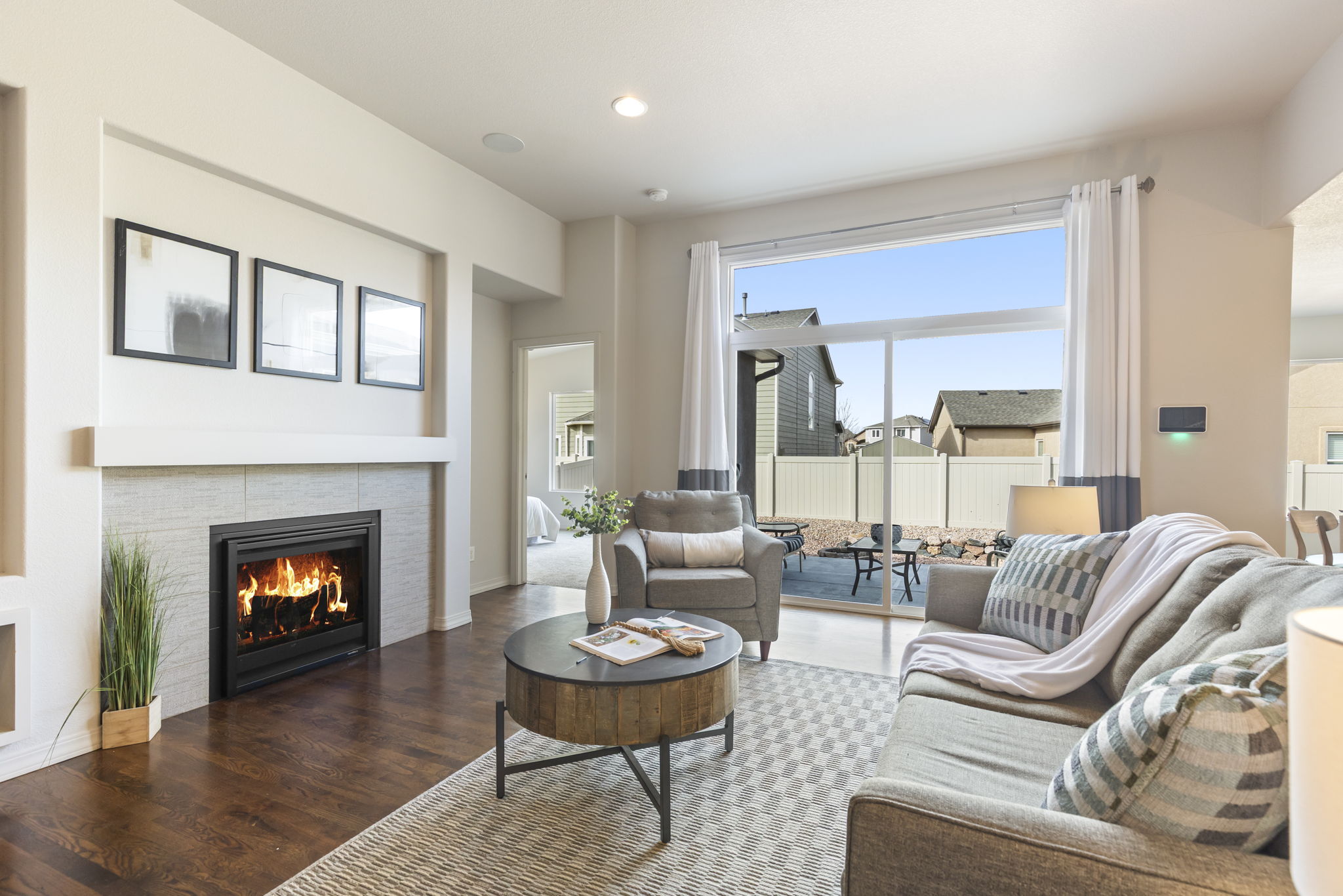 Gas fireplace anchoring the main living space with lots of natural light