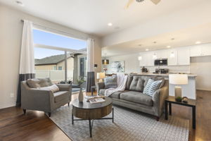 Living room featuring a ceiling fan, beautiful hardwood floors, and recessed lighting