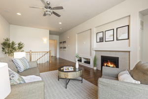Great room featuring a gas fireplace, surround sound, media center, and indoor/outdoor access for Colorado living