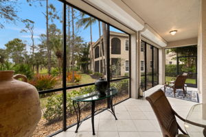 Lanai tiled in  same neutral tone  as the house