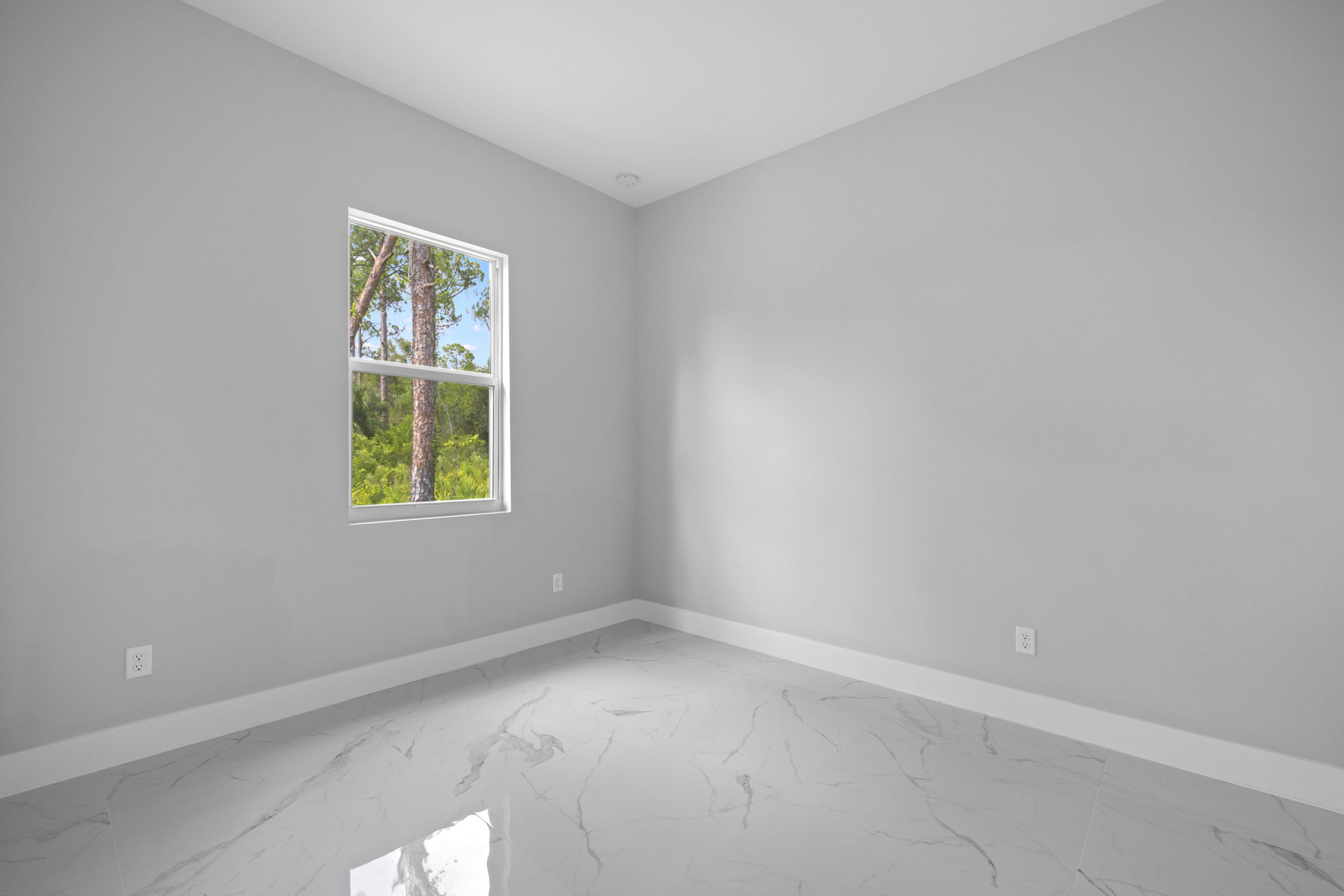 Bedroom 3 with large window for abundant natural light