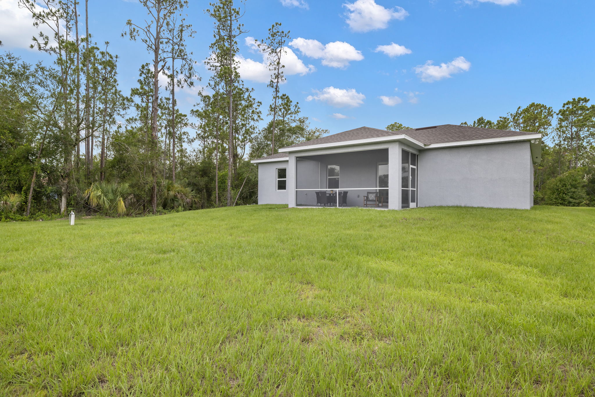 Back Exterior - Half acre - irrigation system throughout entire lot - plenty of room for a pool
