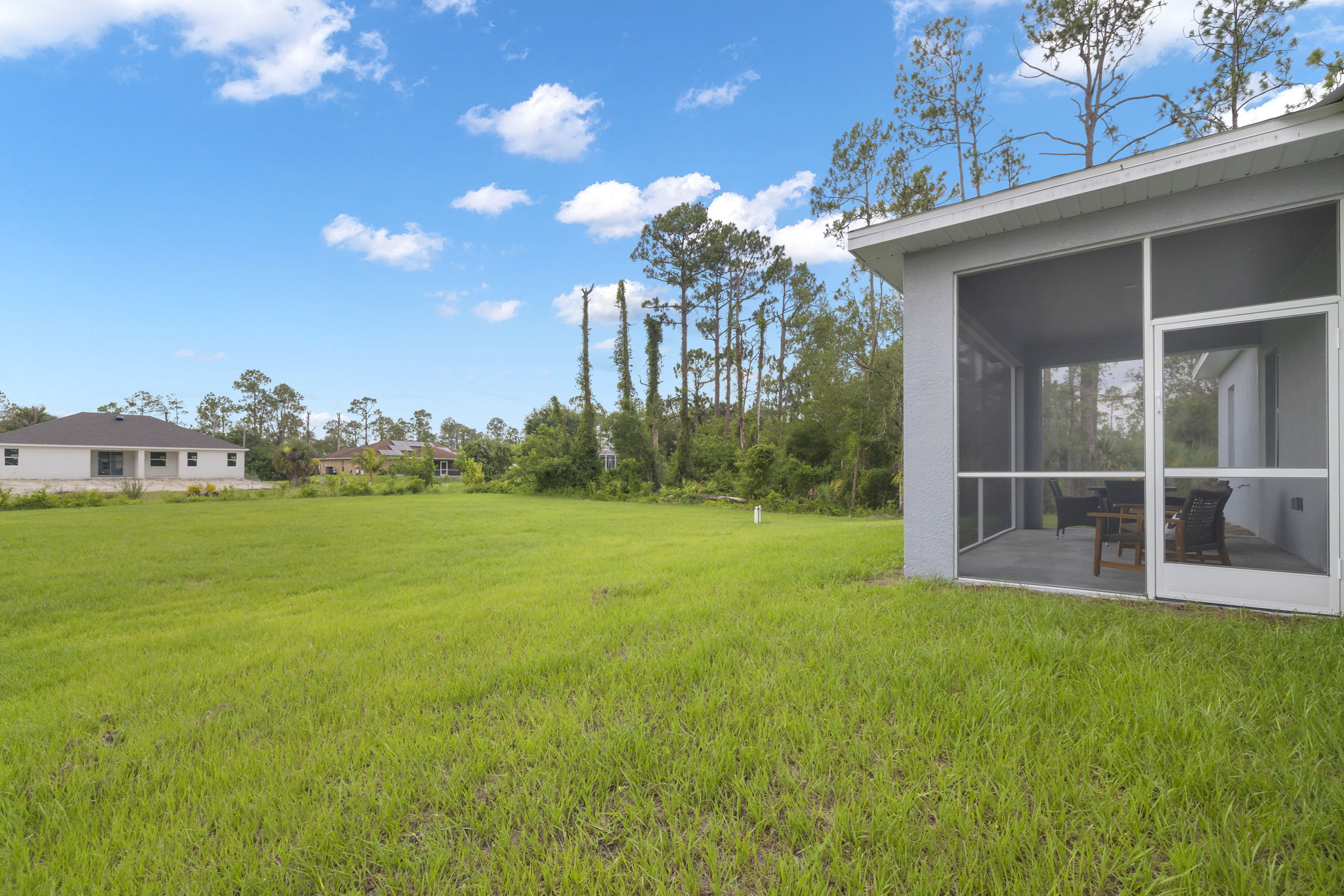 Back Exterior - Fully screened in covered lanai